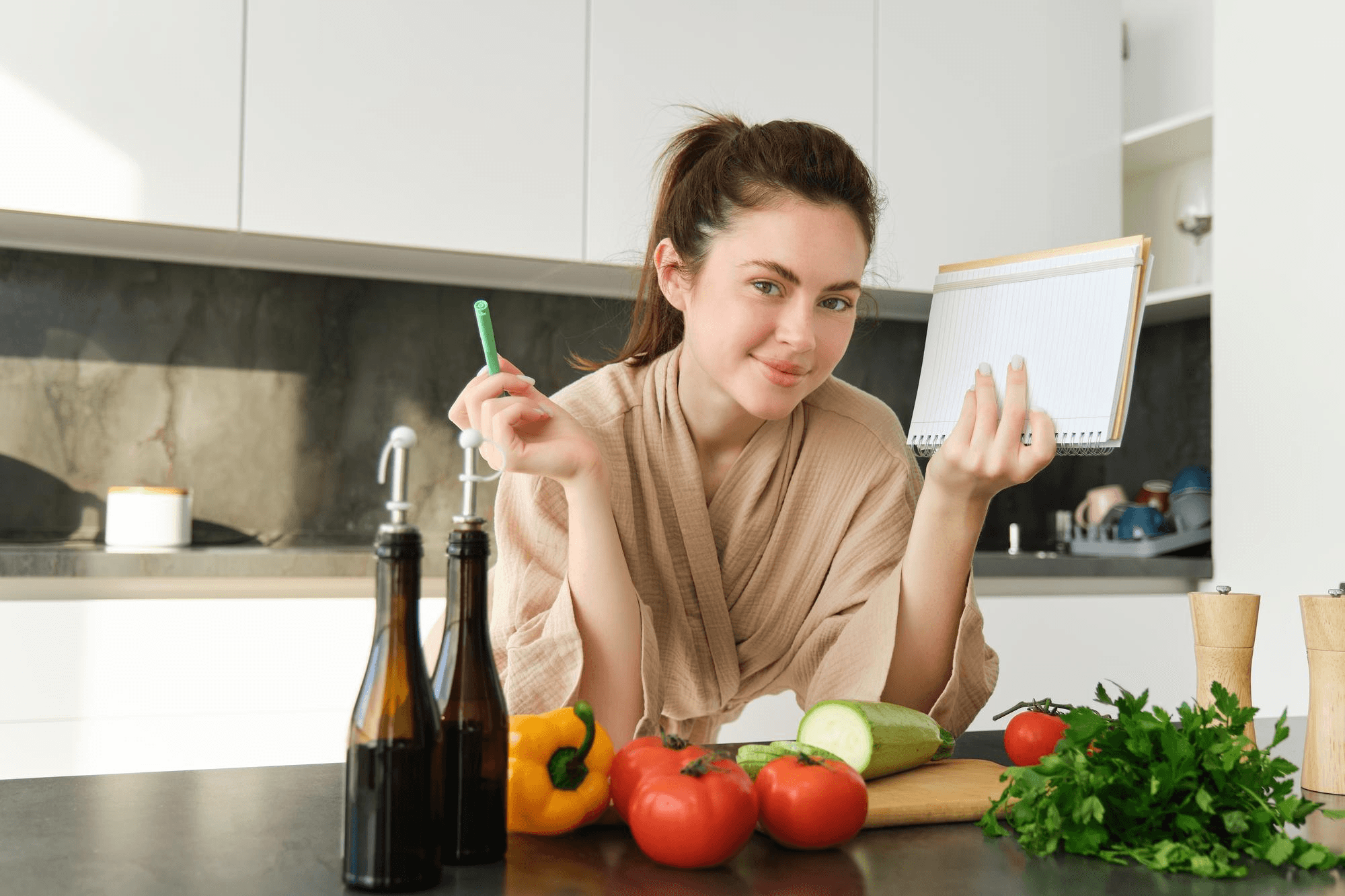 Woman holding a notepad with fresh vegetables, representing nutrition planning and healthy eating habits essential for women’s wellness and a balanced diet.