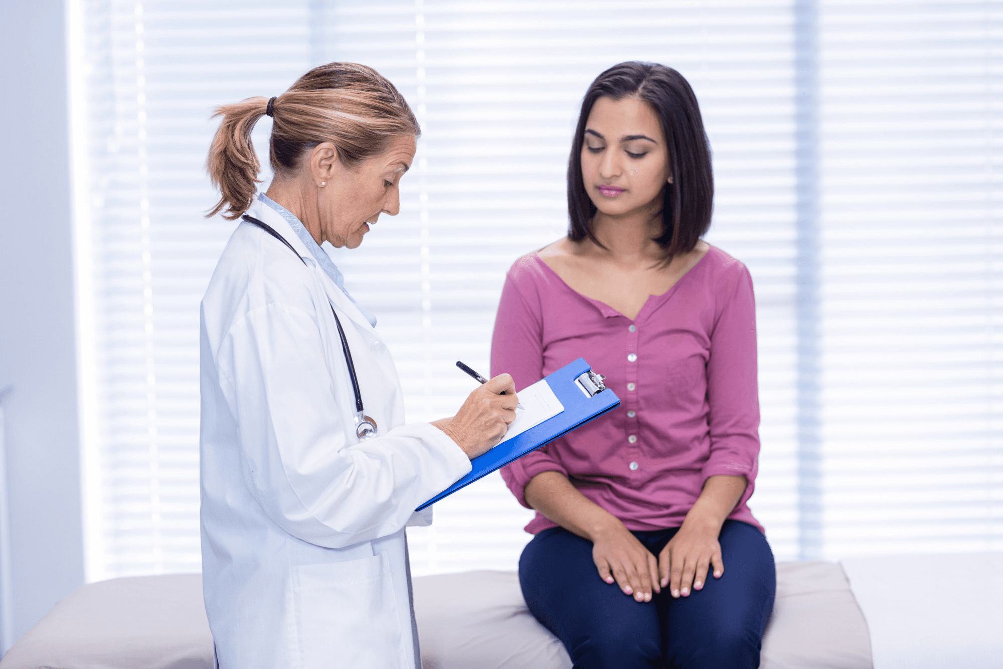 Female patient consulting a gynecologist in a clinic, discussing hormonal issues and treatment options for better reproductive and overall health
