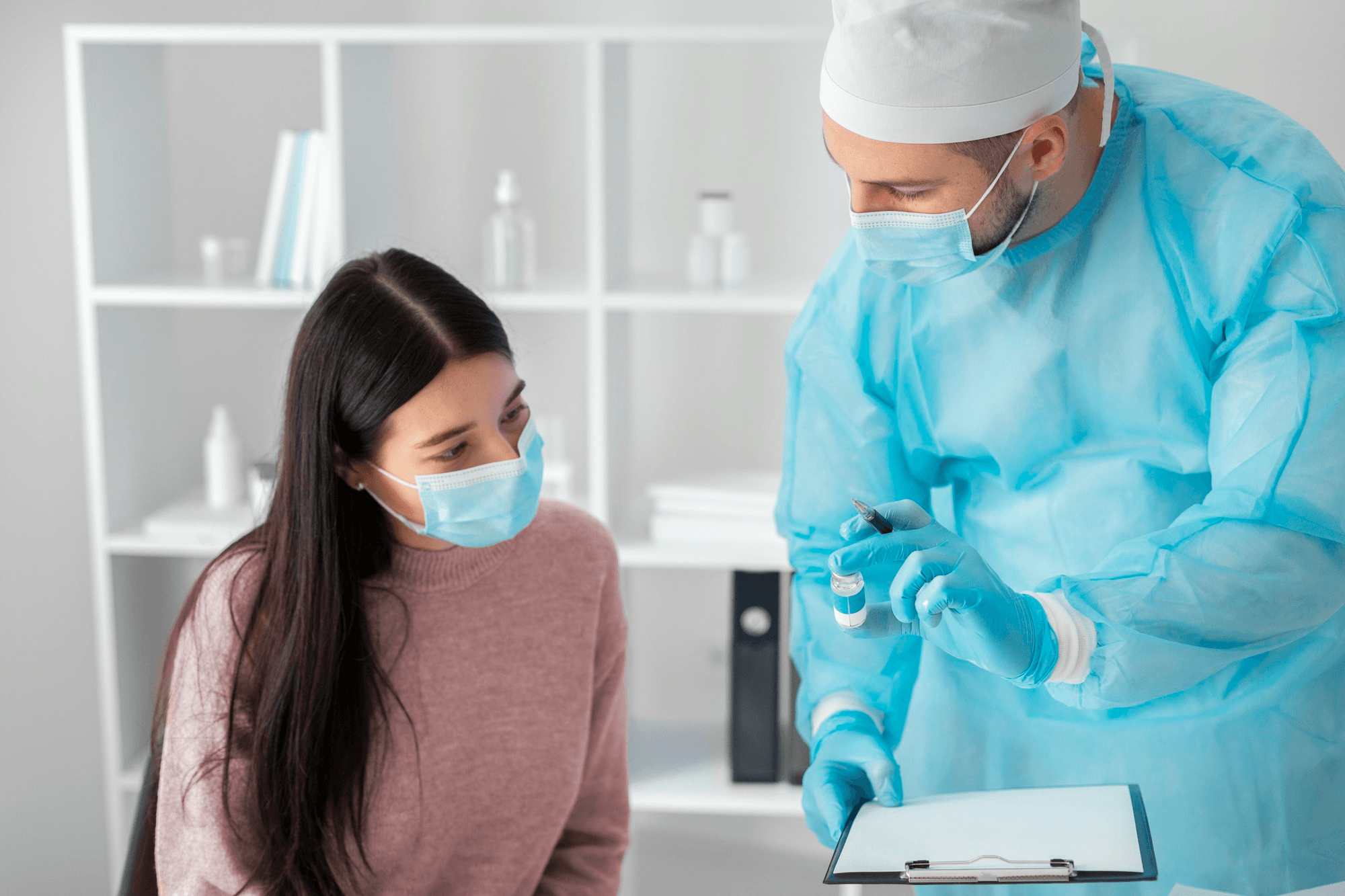 Doctor explaining the importance of screening tests to a female patient.