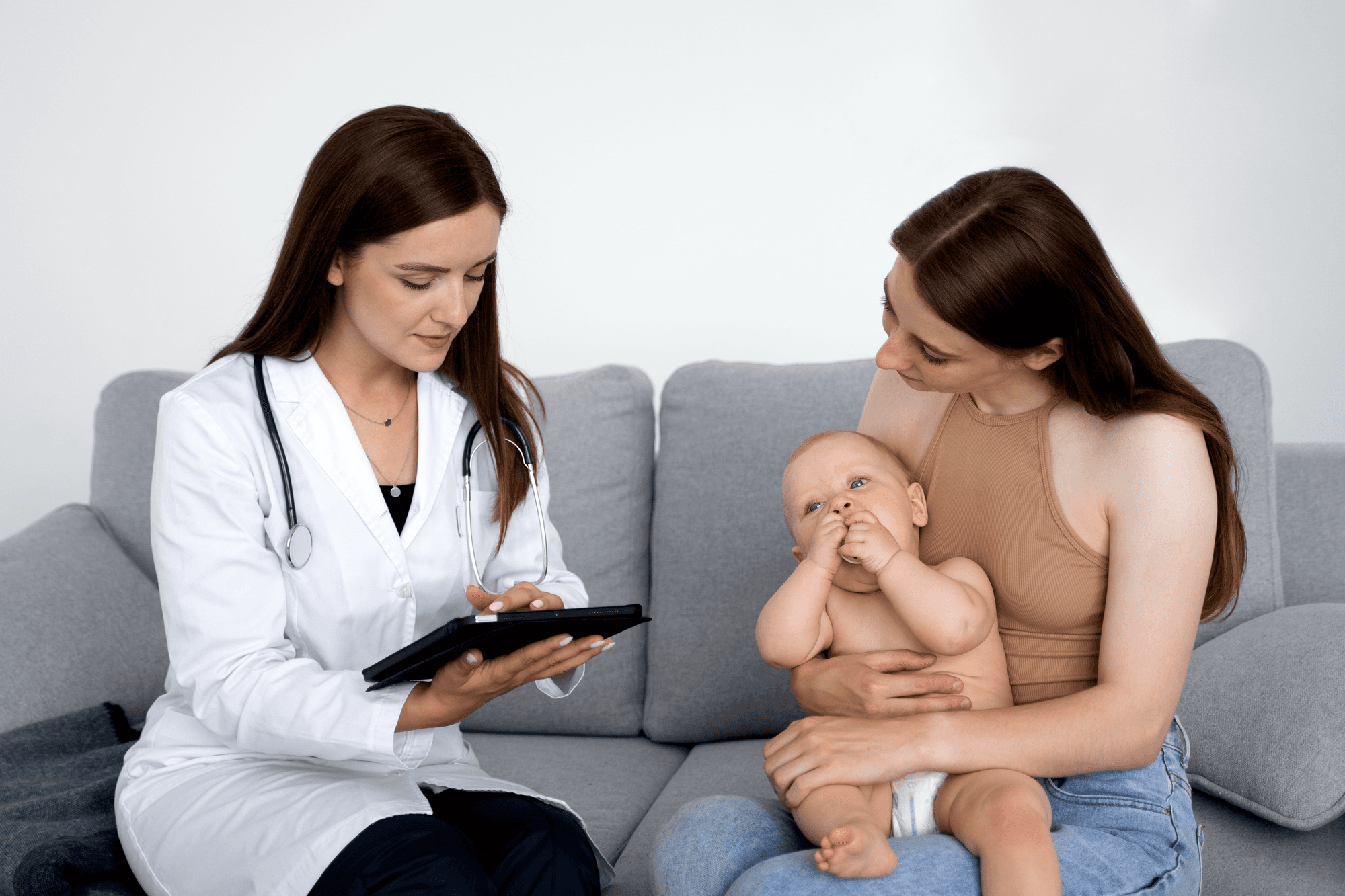A new mother attending a gynaecology appointment to discuss postpartum healing and recovery, seeking professional guidance and healthcare support for her maternal well-being.