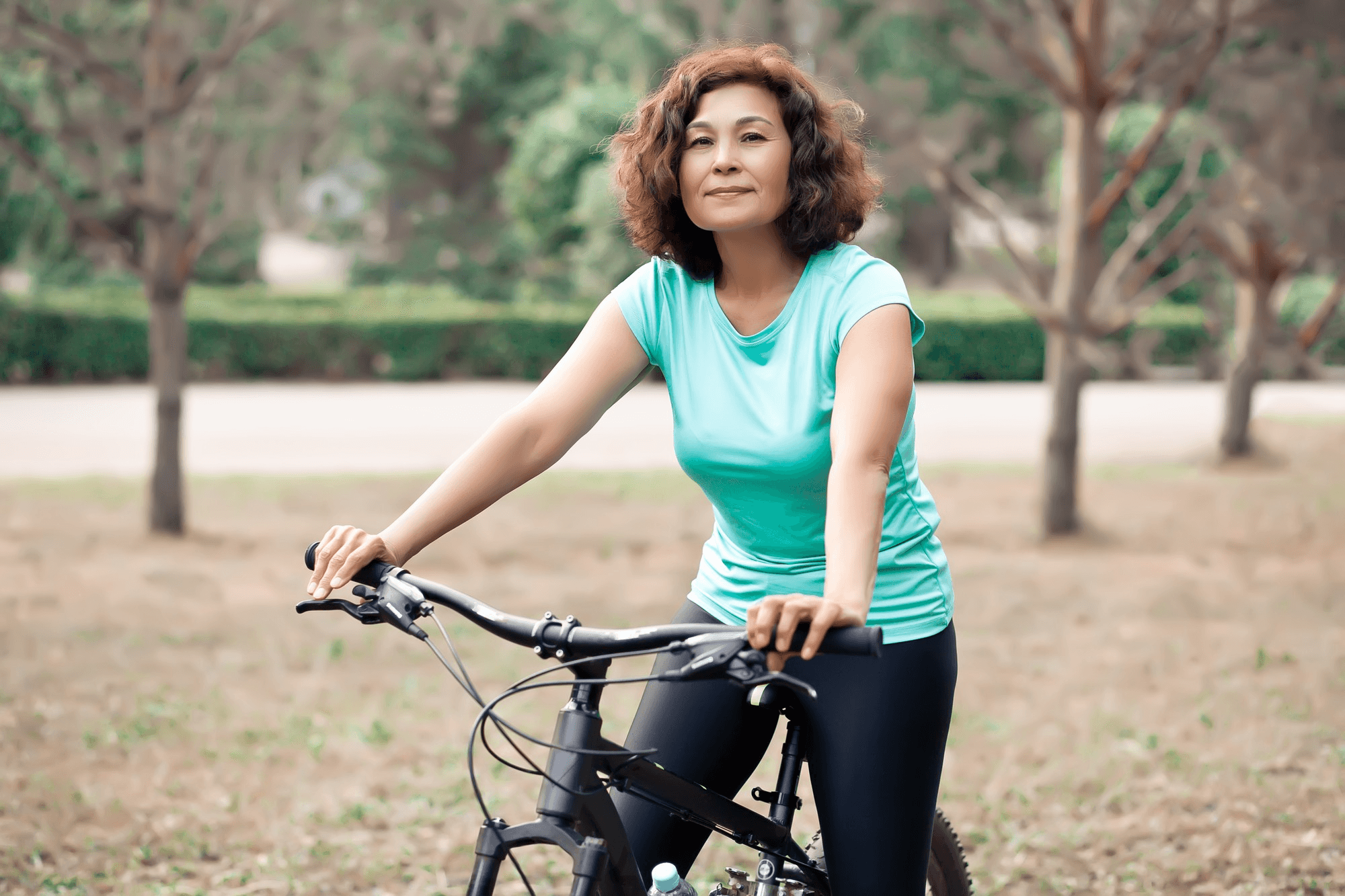 Post-labiaplasty recovery-a woman cycling outside in a healthy environment