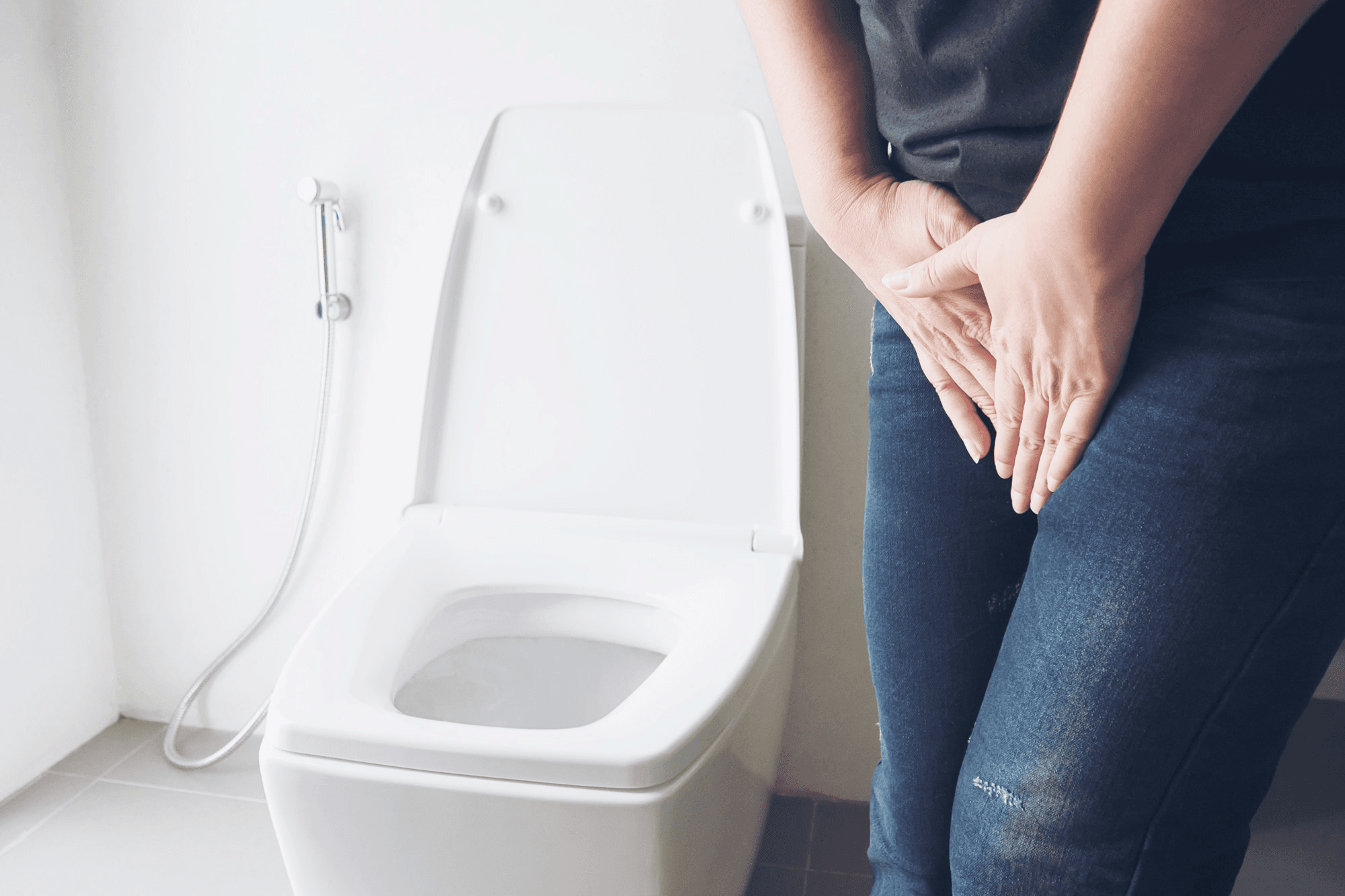 It shows a female holding her lower abdomen and indicating the need to urinate due to irritability and vaginal atrophy syndrome.