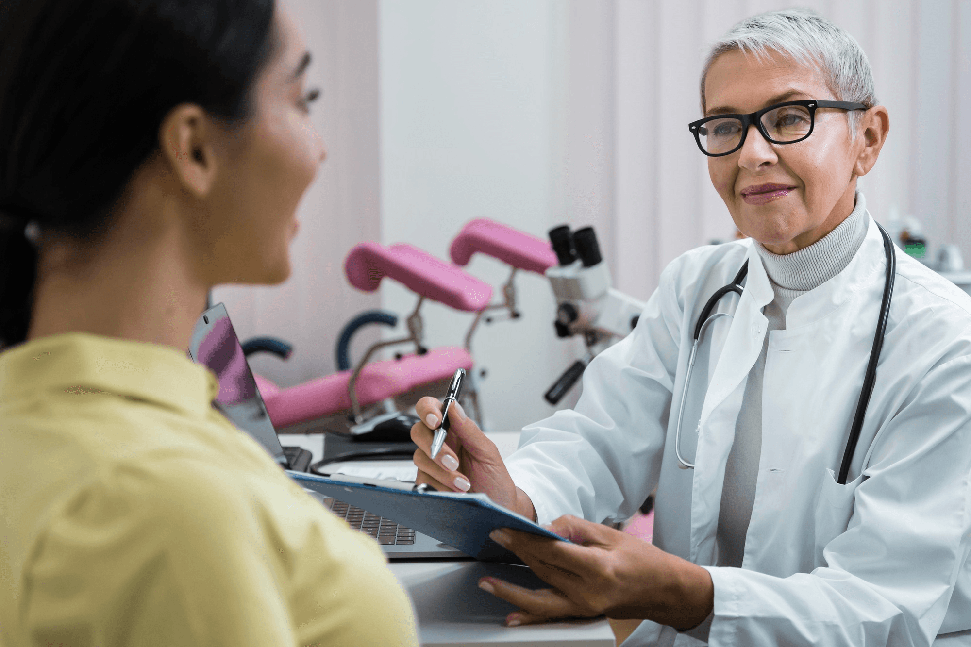 A doctor is explaining health information about menopause with a patient.