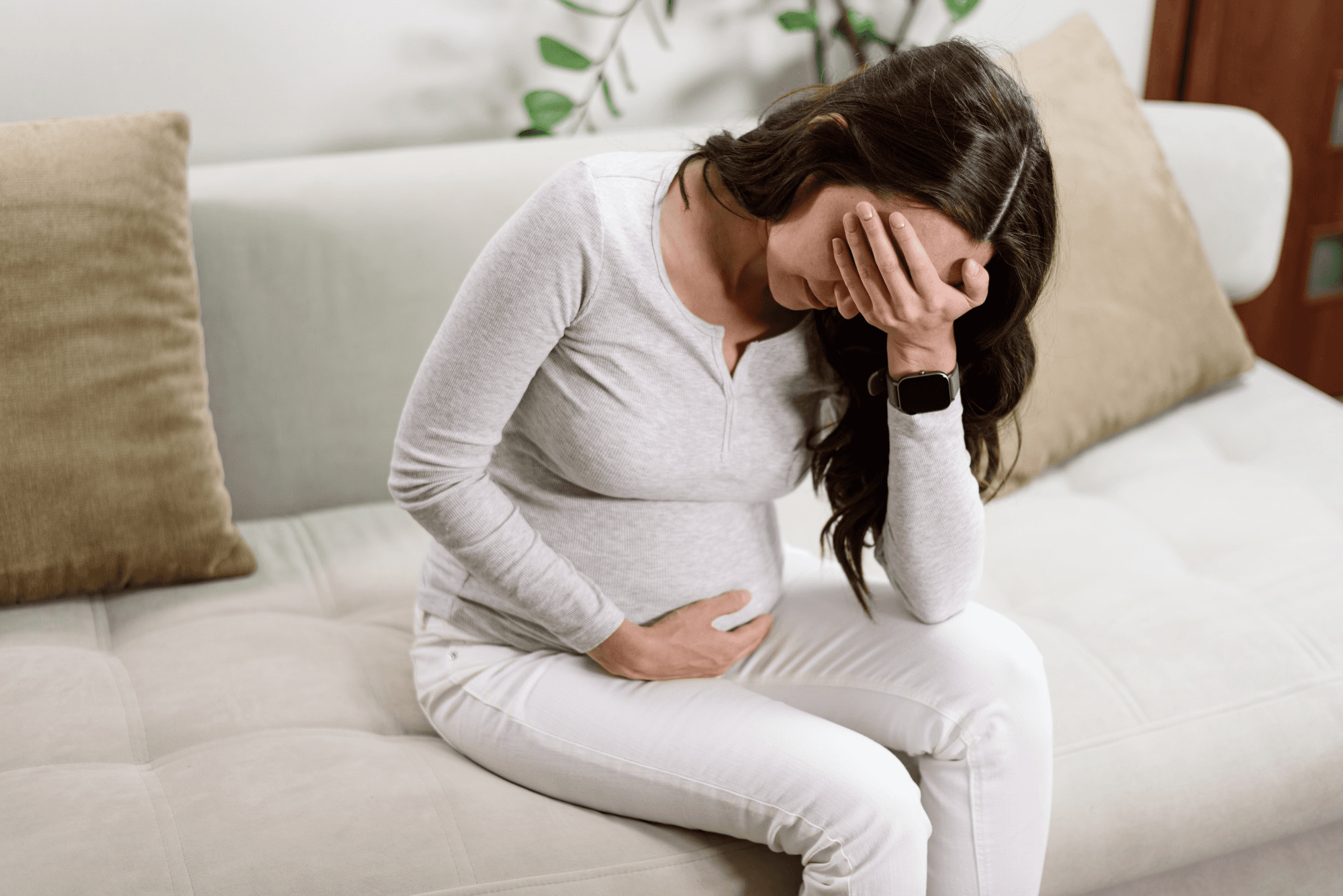 Emotional turmoil and discomfort accompany the possibility of pregnancy loss during a miscarriage scare.