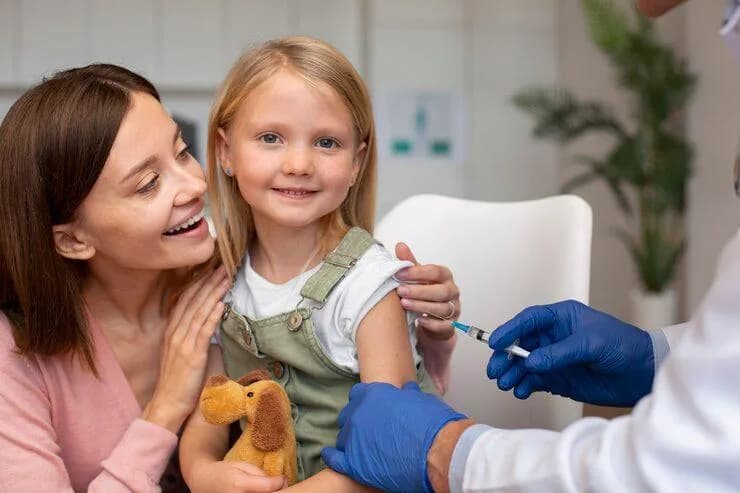 Child getting necessary vaccines
