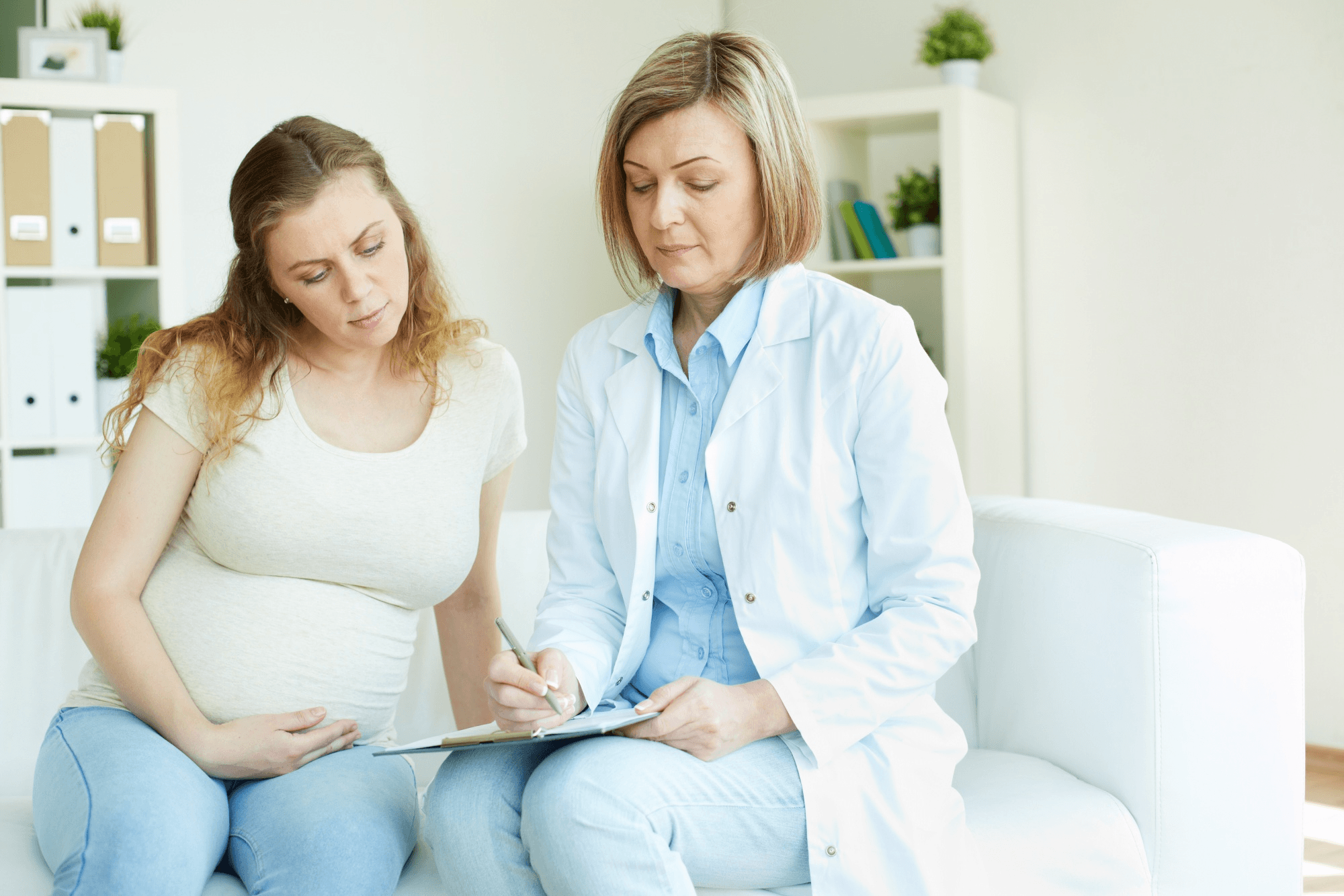 Pregnant woman visiting a doctor.
