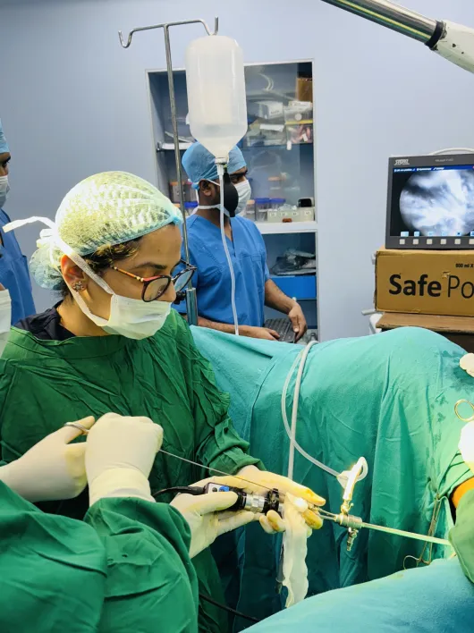 Dr. Shachi Singh and surgical assistants focused on a minimally invasive surgery